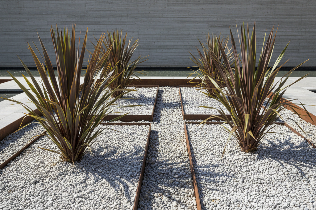 Modern landscape with phormiums as dramatic accents in gravel beds